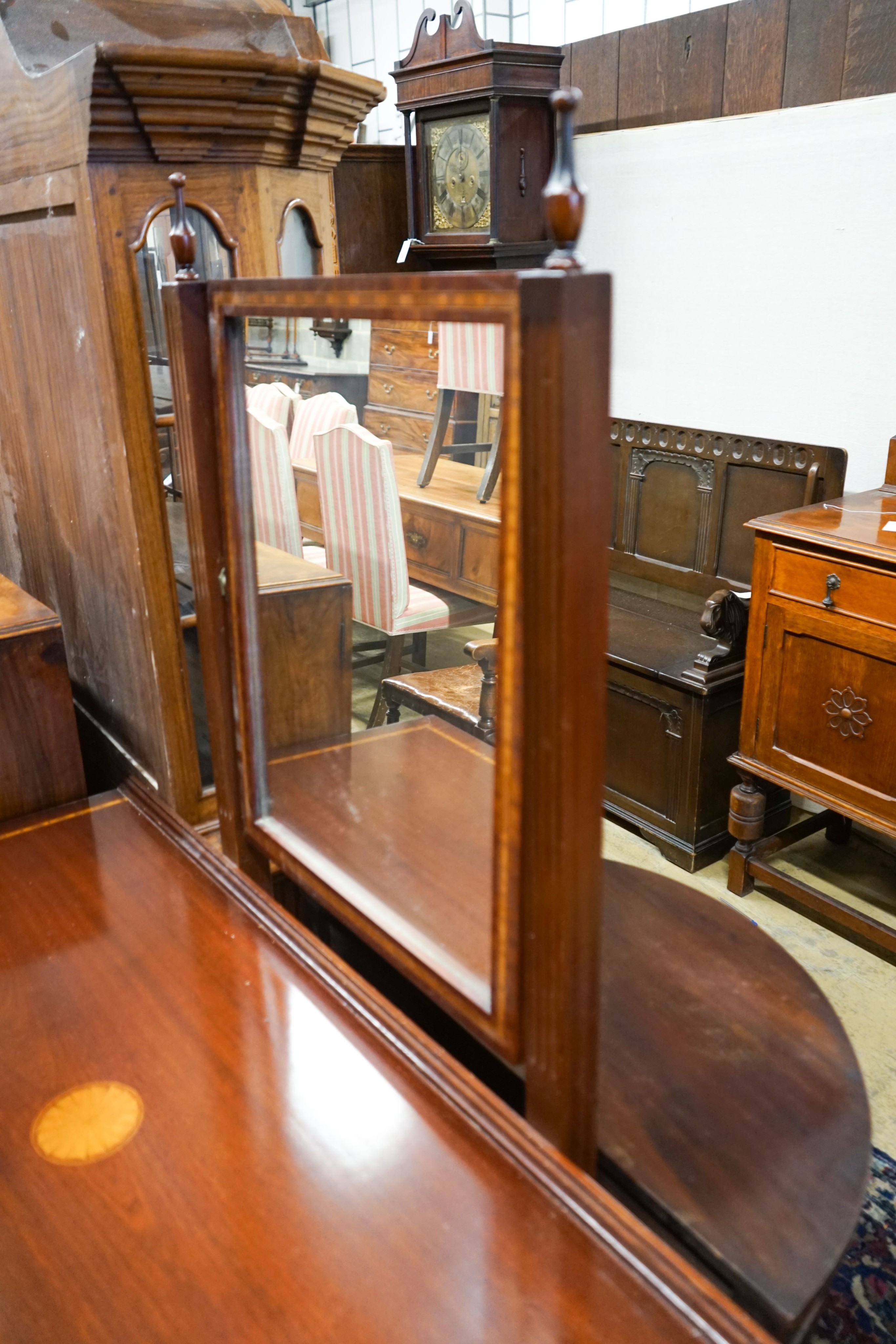 An Edwardian style inlaid mahogany dressing table with swing mirror, length 128cm, depth 54cm, height 158cm